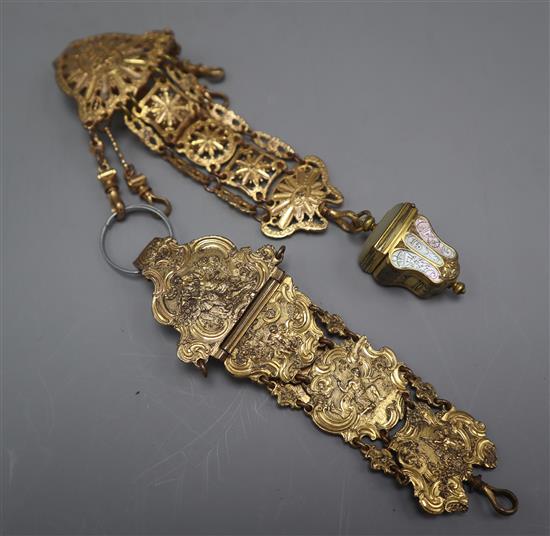 An 18th century Continental gilt metal chatelaine, with mother of pearl inlaid thimble case and another chatelaine